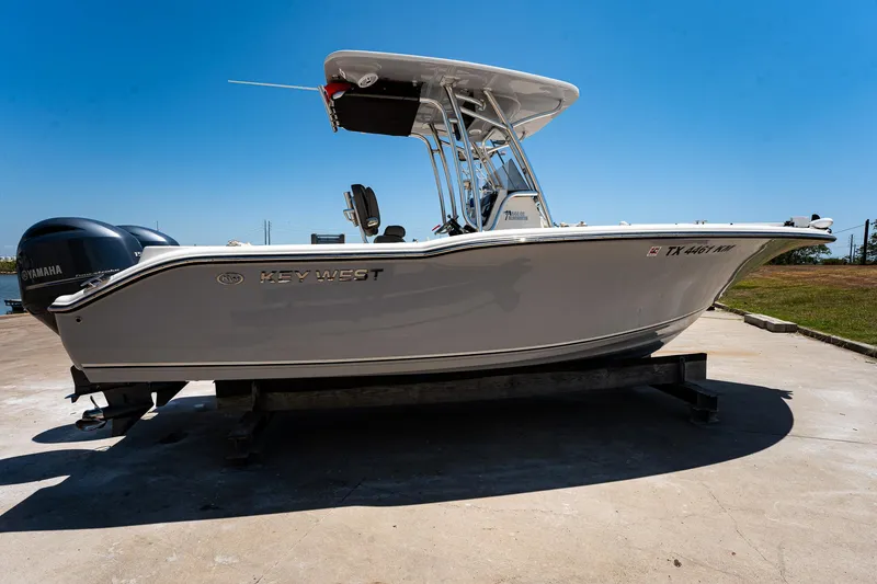 Slide: The Image of 2021 Key West 244 Center Console boat on a trailer, side view. - 8