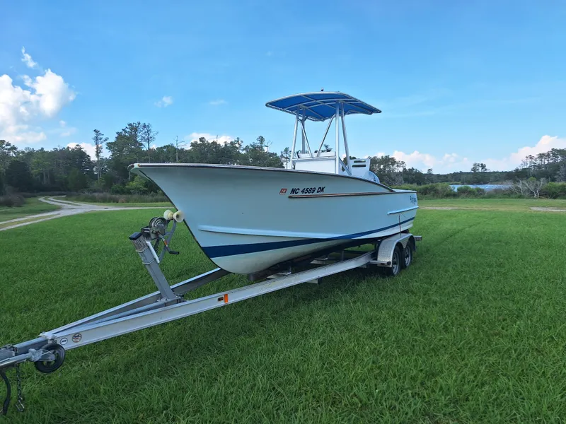 Slide: The Image of 2008 Custom Carolina boat on trailer in grassy field. - 27