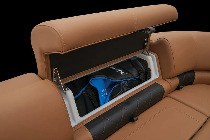 Slide: The Image of 2024 Regency 250 LE3 boat seat storage compartment with life jackets. - 19