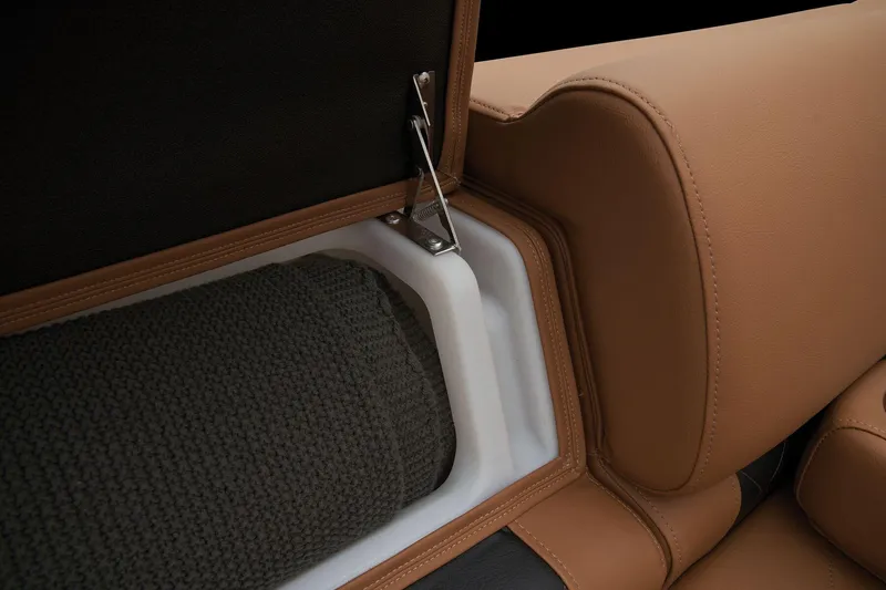 Slide: The Image of Regency 250 LE3 2024 boat seat storage compartment with brown upholstery. - 20