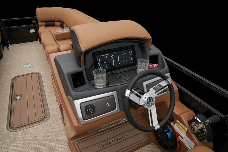 Slide: The Image of 2024 Regency 250 LE3 boat interior with steering wheel and dashboard. - 38