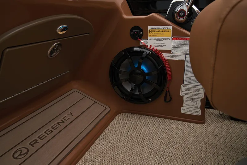Slide: The Image of 2024 Regency 250 LE3 boat interior, featuring speaker and control panel. - 42