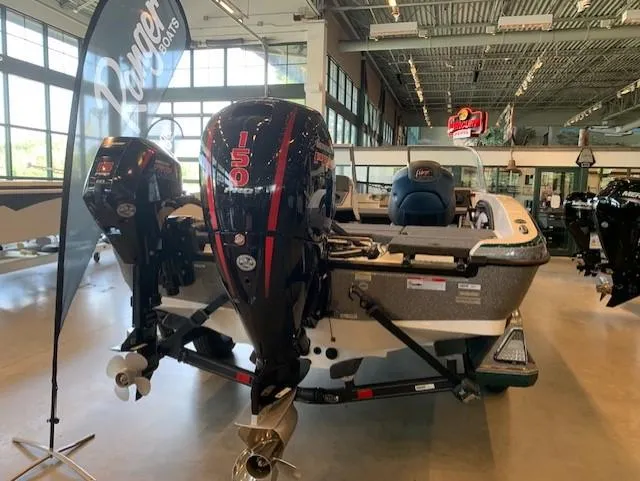 Slide: The Image of 2024 Ranger 1850MS boat with dual 150 horsepower engines in showroom. - 2