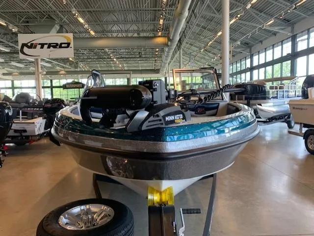 Slide: The Image of 2024 Ranger 1850MS boat with Minn Kota motor in showroom. - 3