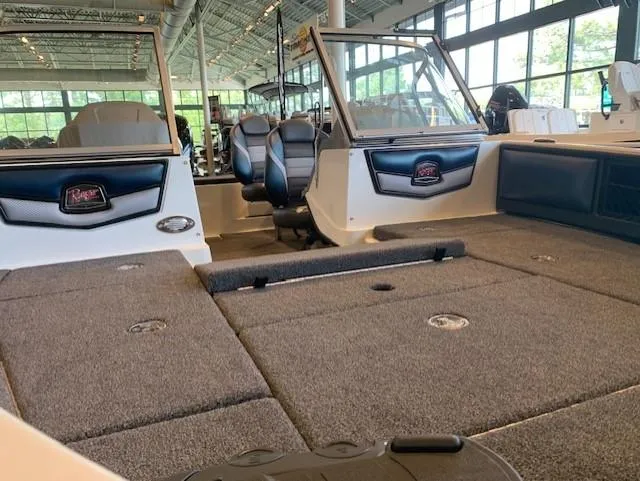 Slide: The Image of 2024 Ranger 1850MS boat interior with seating and carpeted deck. - 5