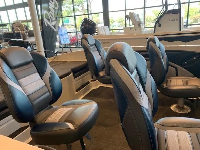 Slide: The Image of 2024 Ranger 1850MS boat interior with comfortable seating and modern design. - 6