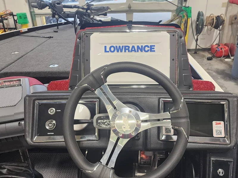 Slide: The Image of 2024 Ranger Z520R Ranger Cup Equipped boat dashboard with Lowrance display and steering wheel. - 10