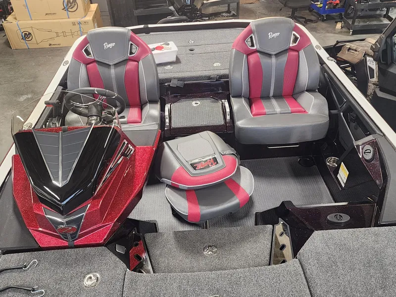 Slide: The Image of 2024 Ranger Z520R Ranger Cup Equipped boat interior with red and gray seats. - 6