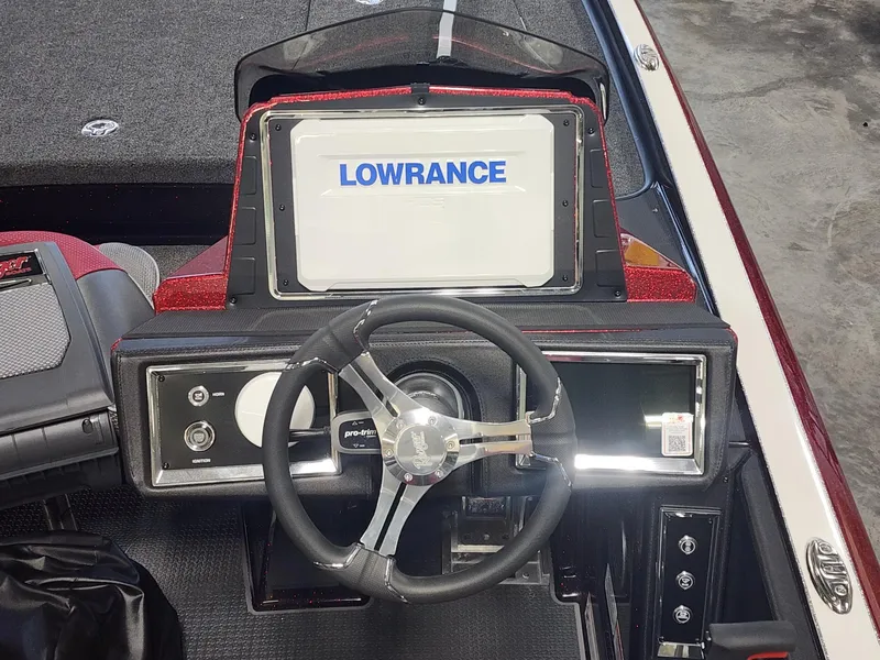 Slide: The Image of 2024 Ranger Z520R Ranger Cup Equipped boat dashboard with Lowrance display and steering wheel. - 8