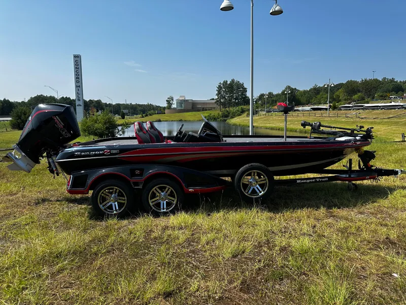 Slide: The Image of 2024 Ranger Z520R Ranger Cup Equipped boat on a grassy field. - 1