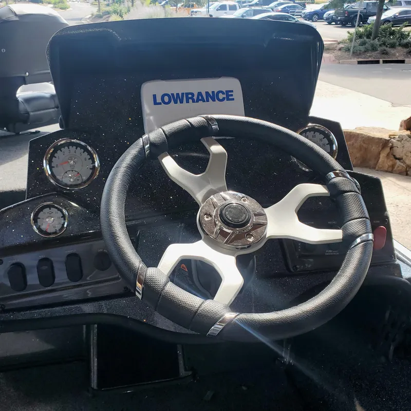 Slide: The Image of Steering wheel and dashboard of 2024 Nitro Z18 boat with Lowrance electronics. - 5