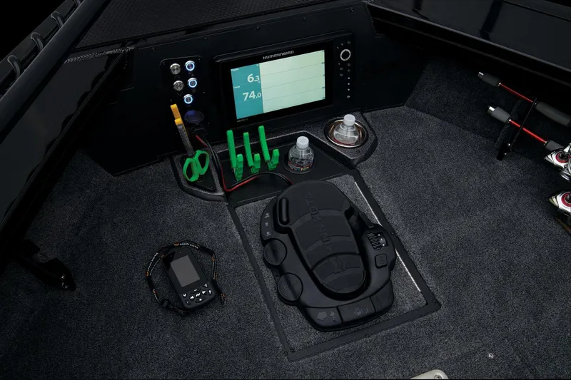 Slide: The Image of 2024 Ranger VX1888 WT boat cockpit with control panel and fishing gear. - 25