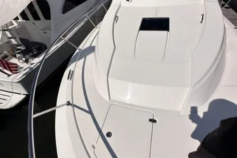 Slide: The Image of 2022 Pursuit OS 355 boat deck with hatch and railing. - 22