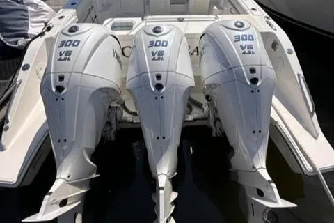 Slide: The Image of 2022 Pursuit OS 355 boat with triple 300 V6 outboard engines. - 23