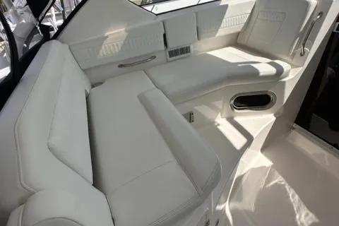 Slide: The Image of 2022 Pursuit OS 355 boat interior with white leather seating. - 30