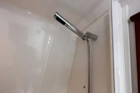 Slide: The Image of Showerhead in the 2022 Pursuit OS 355 boat bathroom. - 46