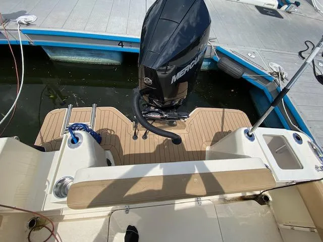 Slide: The Image of 2020 Scout 235 XSF boat with Mercury outboard engine at dock. - 11