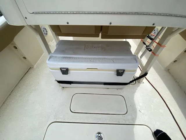 Slide: The Image of Cooler storage area on a 2020 Scout 235 XSF boat. - 12