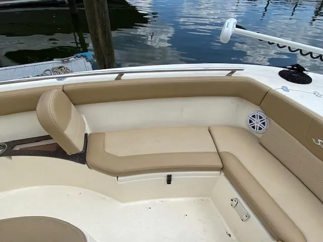 Slide: The Image of 2020 Scout 235 XSF boat interior with beige seating and white accents. - 24
