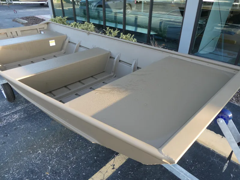 Slide: The Image of 2024 G3 1442 aluminum boat on trailer outside dealership. - 3