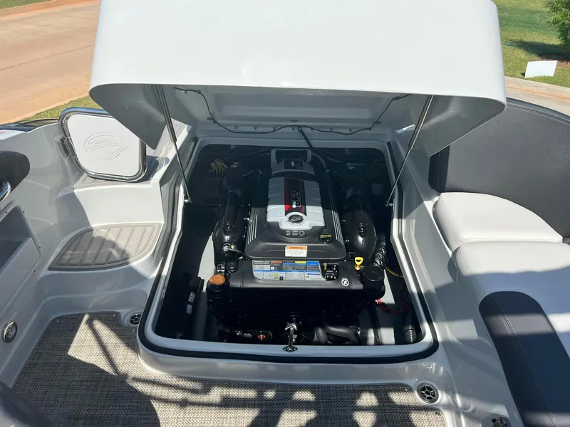 Slide: The Image of 2024 Crownline 260SS boat engine compartment with open hatch. - 13