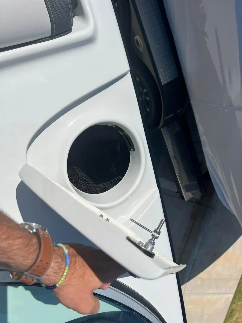 Slide: The Image of 2024 Crownline 260SS boat cup holder and storage compartment. - 14
