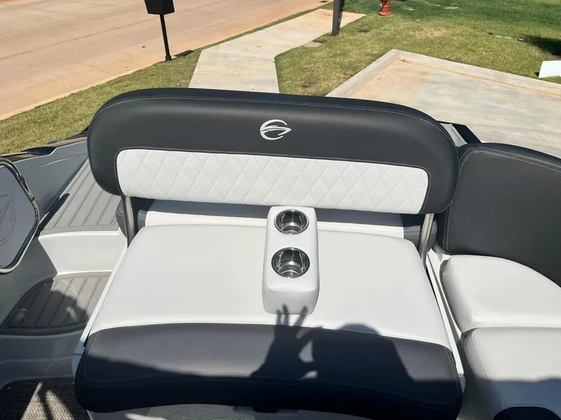 Slide: The Image of 2024 Crownline 260SS boat seating with cup holders. - 16