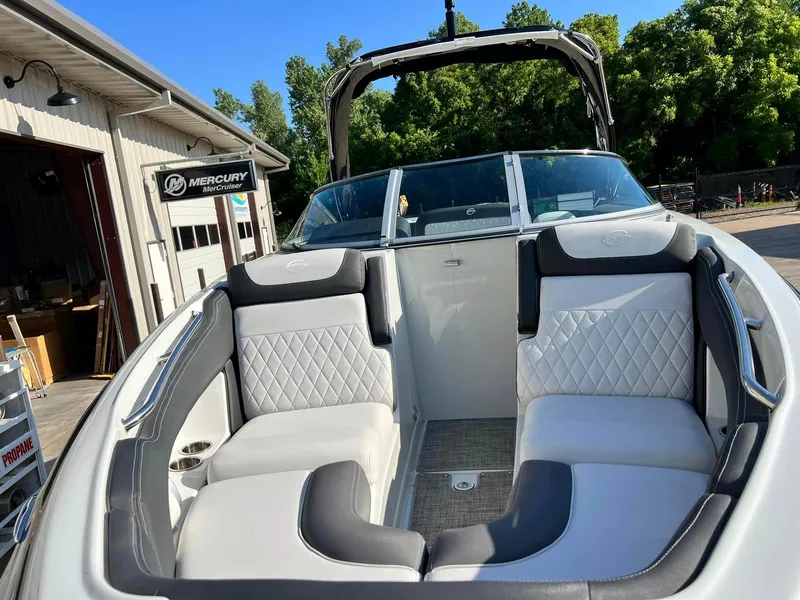 Slide: The Image of 2024 Crownline 260SS boat interior with white and gray seating. - 5