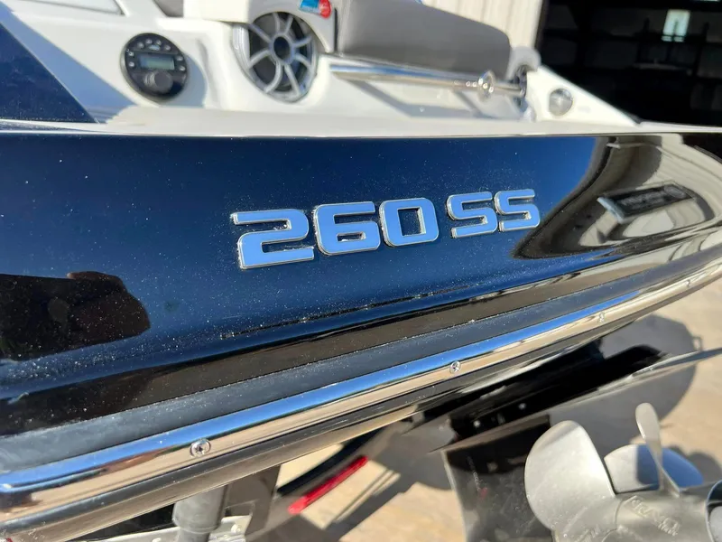Slide: The Image of 2024 Crownline 260SS boat model close-up with logo and dashboard. - 6