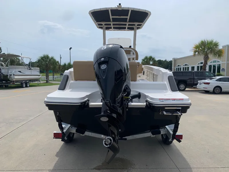 Slide: The Image of 2024 Bayliner Trophy 20 CC boat with outboard motor, rear view. - 2