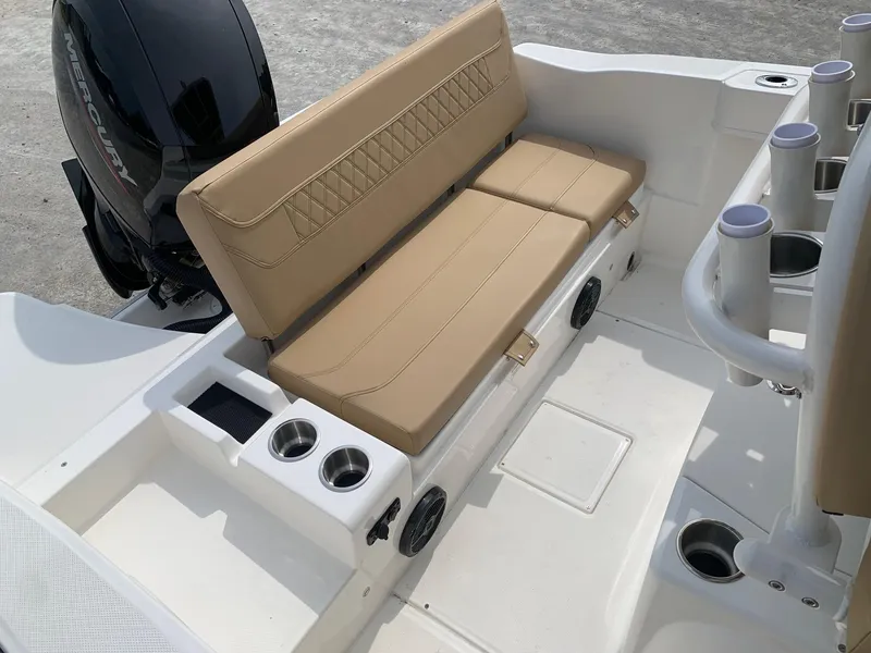 Slide: The Image of 2024 Bayliner Trophy 20 CC boat with tan seating and cup holders. - 15