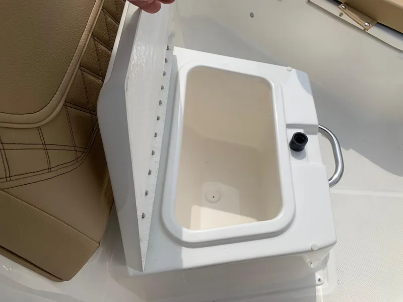 Slide: The Image of 2024 Bayliner Trophy 20 CC boat storage compartment with open lid. - 10