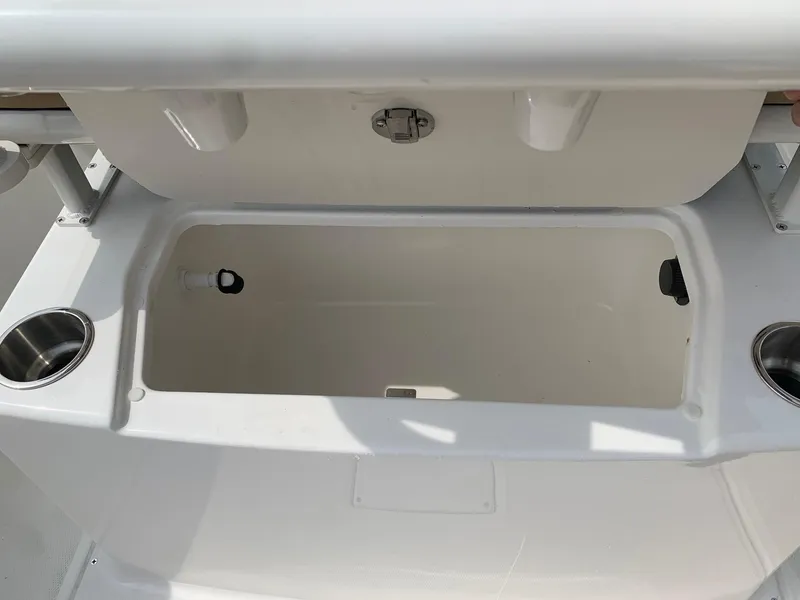 Slide: The Image of 2024 Bayliner Trophy 20 CC center console storage compartment. - 17