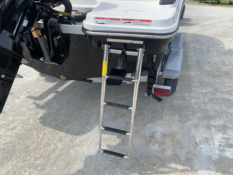 Slide: The Image of 2024 Bayliner Trophy 20 CC boat with extended swim ladder. - 4