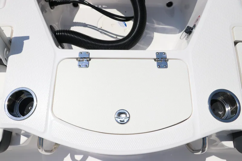Slide: The Image of 2024 Robalo 206 Cayman boat deck with storage compartment and cup holders. - 11