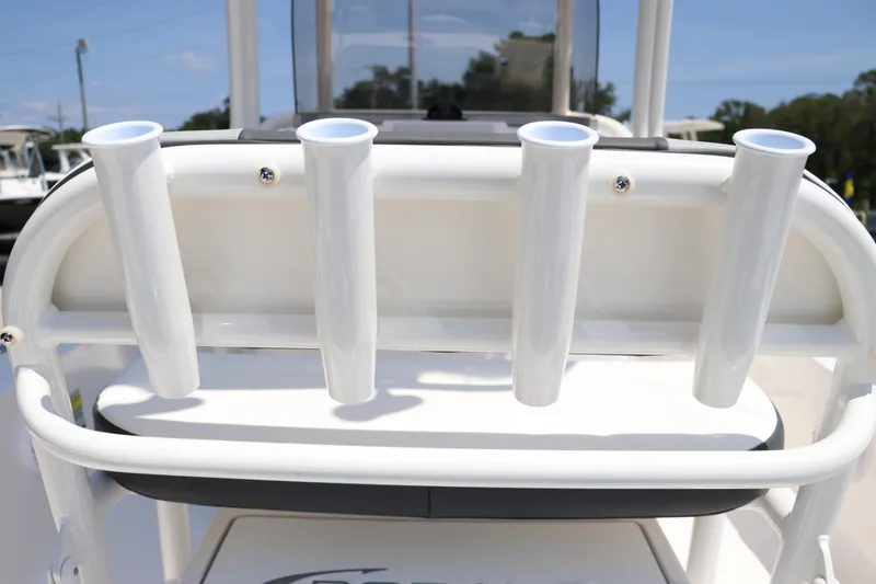 Slide: The Image of 2024 Robalo 206 Cayman boat rod holders on deck, featuring sleek white design. - 20