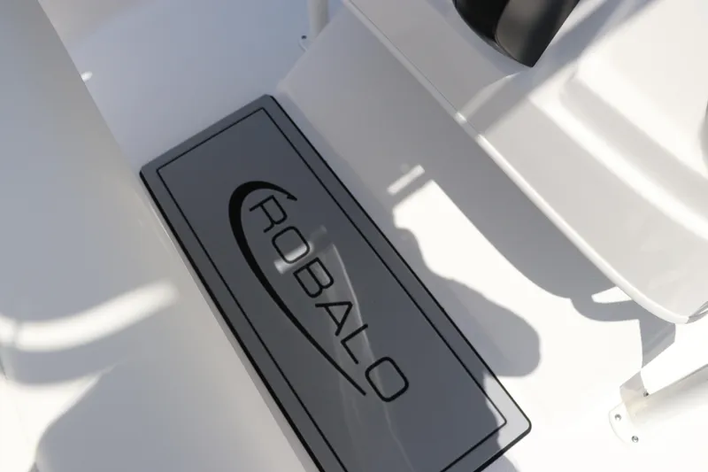 Slide: The Image of 2024 Robalo 206 Cayman boat interior with branded floor mat. - 23