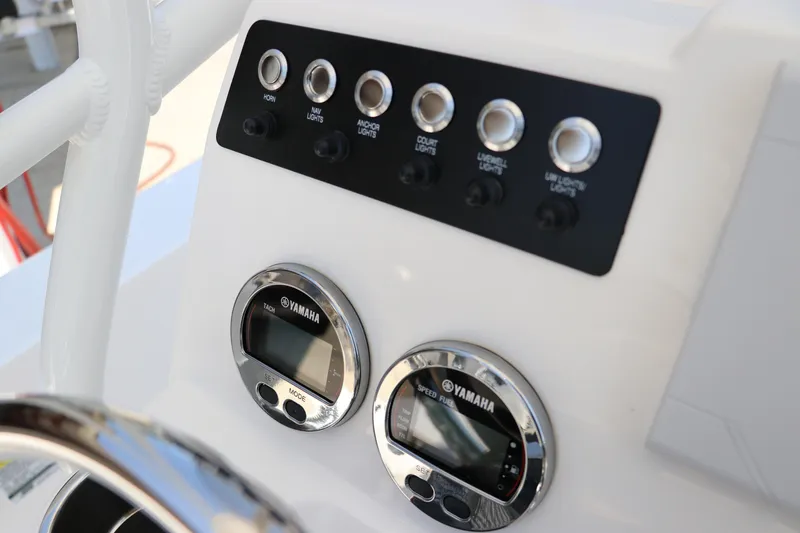 Slide: The Image of Control panel of 2024 Robalo 206 Cayman boat with Yamaha gauges and switches. - 25