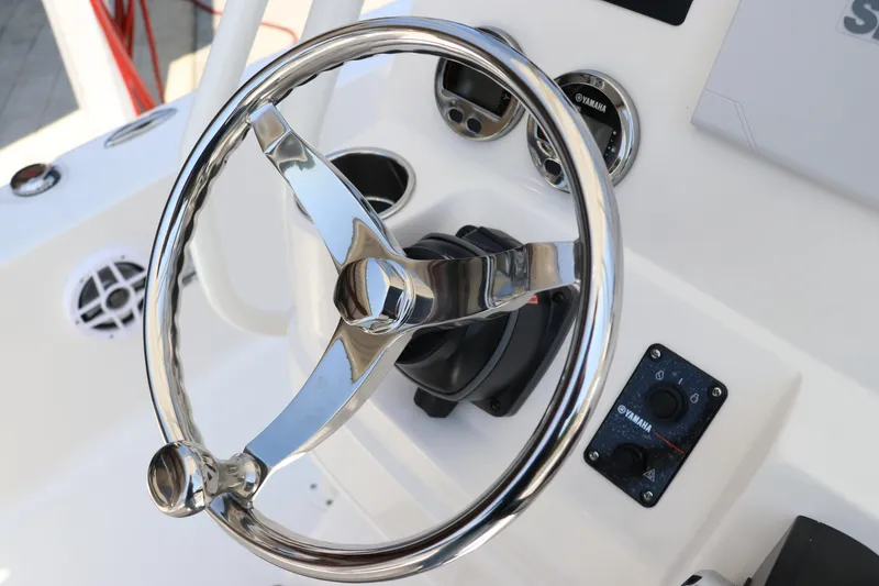 Slide: The Image of Steering wheel of 2024 Robalo 206 Cayman boat with control panel and gauges. - 27