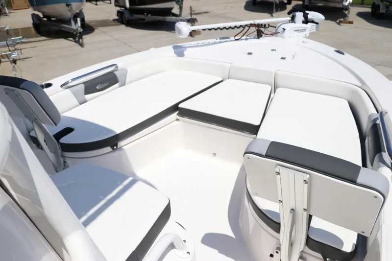 Slide: The Image of 2024 Robalo 206 Cayman boat interior with white cushioned seating and modern design. - 28