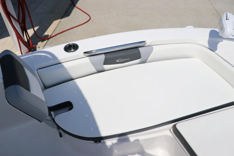 Slide: The Image of 2024 Robalo 206 Cayman boat interior with white cushioned seating. - 29