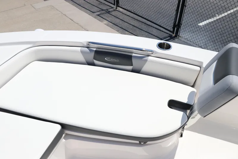 Slide: The Image of 2024 Robalo 206 Cayman boat interior with cushioned seating and cup holder. - 31