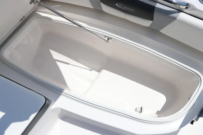 Slide: The Image of 2024 Robalo 206 Cayman boat storage compartment, open and empty, showcasing interior space. - 32