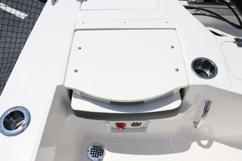 Slide: The Image of 2024 Robalo 206 Cayman boat deck with storage compartment and cup holders. - 8