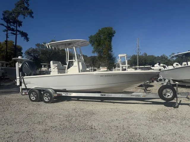 The Image of 2023 Pathfinder 2500 Hybrid boat on trailer outdoors. - 1