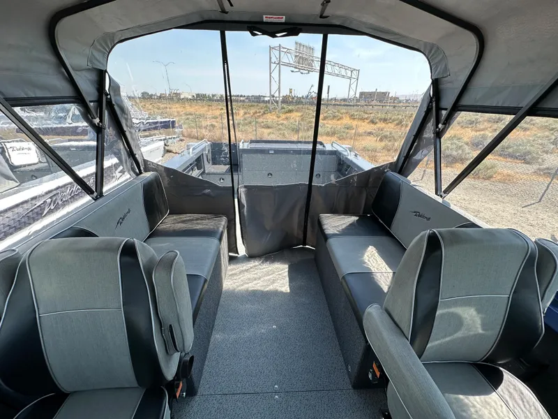 Slide: The Image of Interior of 2024 Weldcraft 220 Maverick boat with seating and canopy. - 6