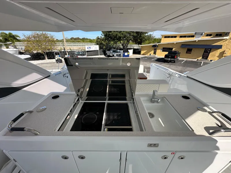 Slide: The Image of Outdoor kitchen area on the 2024 Jeanneau DB/43 OB boat. - 10