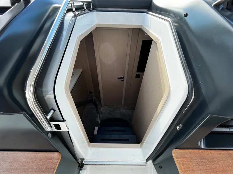 Slide: The Image of 2024 Jeanneau DB/43 OB cabin entrance with modern interior. - 19