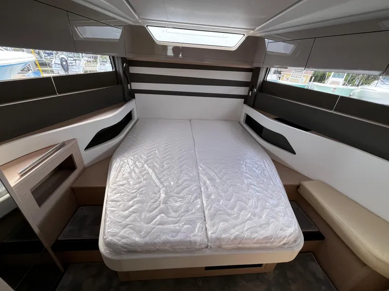 Slide: The Image of 2024 Jeanneau DB/43 OB cabin interior with double bed and modern design. - 22