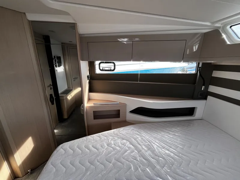 Slide: The Image of 2024 Jeanneau DB/43 OB cabin interior with modern design and natural light. - 24